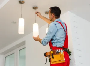 electrician installing a modern lighting fixtures